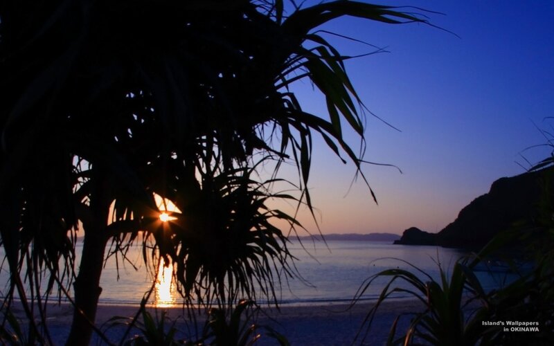 sunset over okinawa beach