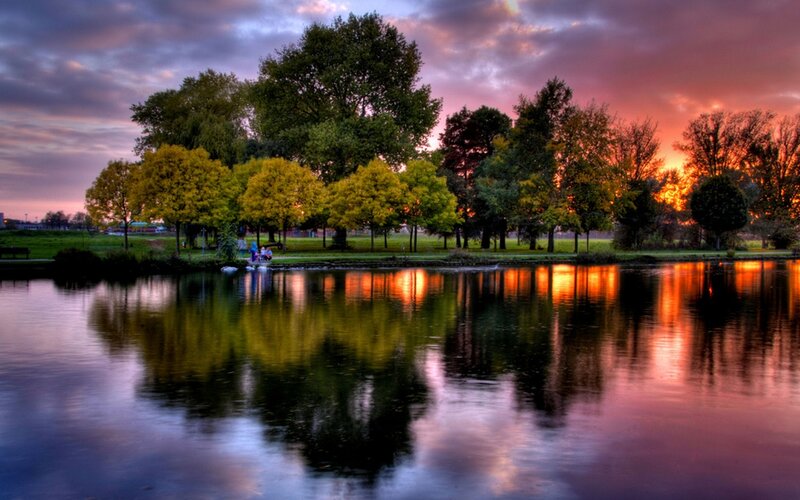 Sunset over park lake