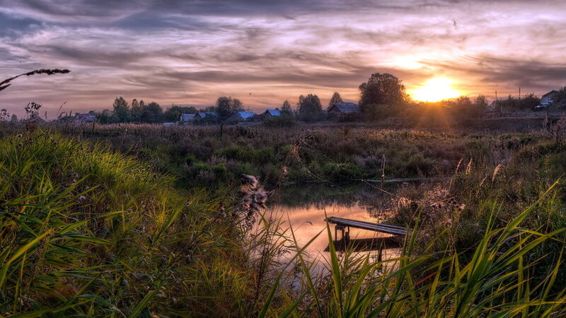Sunset over Pond and Village