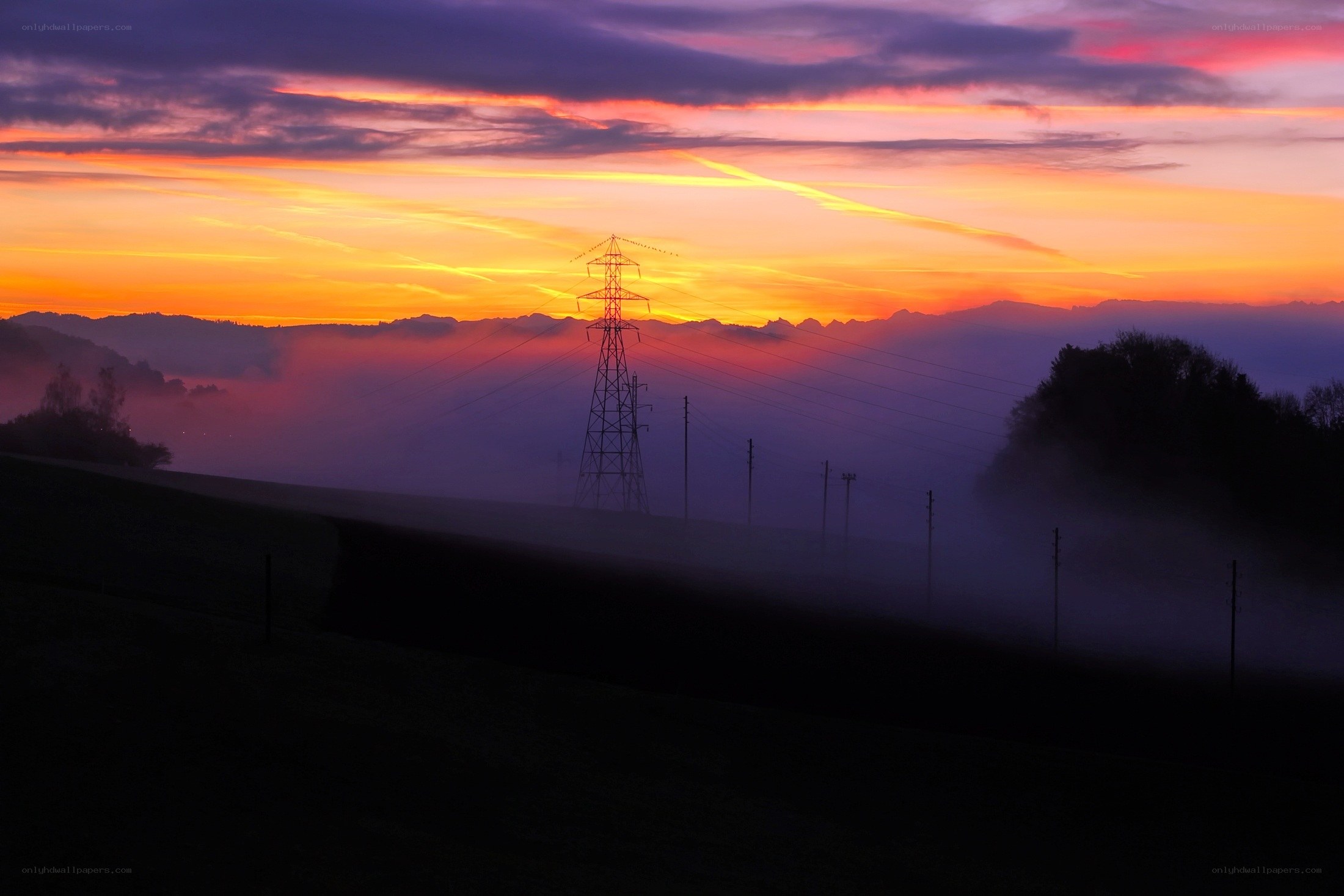 Sunset over power lines