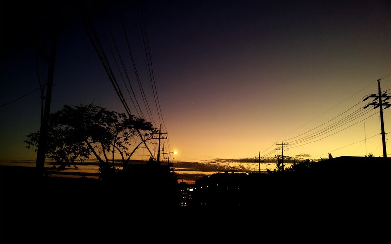 Sunset over power lines