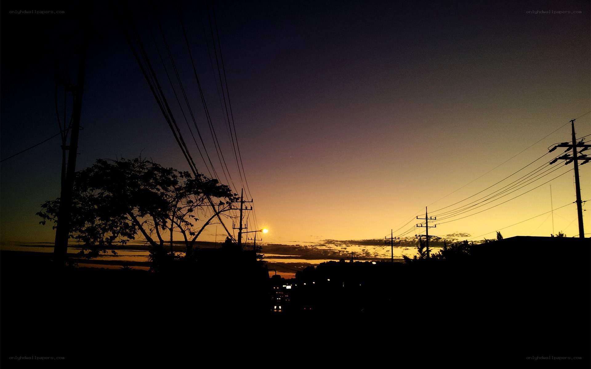 Sunset over power lines