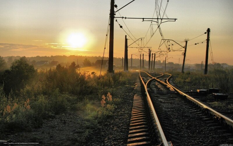 Sunset over railway tracks