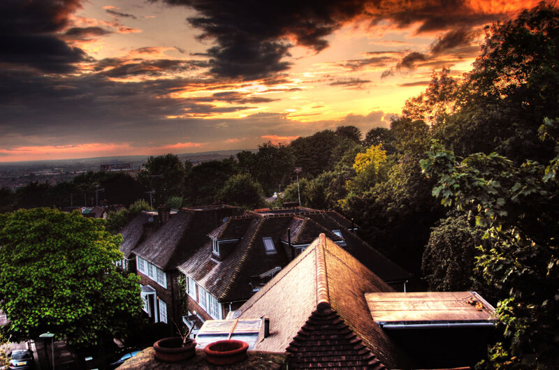 Sunset over residential rooftops