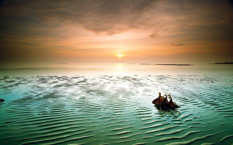 Sunset over rippled water