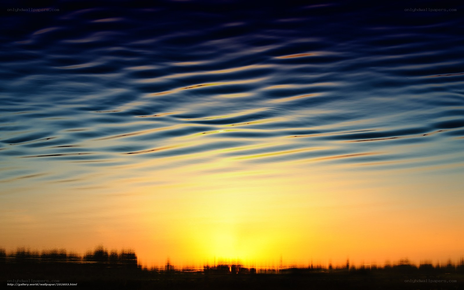 Sunset over rippling water