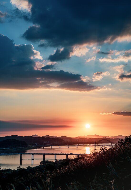 Sunset over River and Bridge — Orange, Dramatic