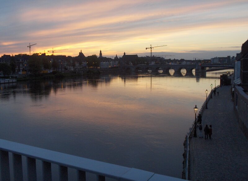 sunset over river and bridge