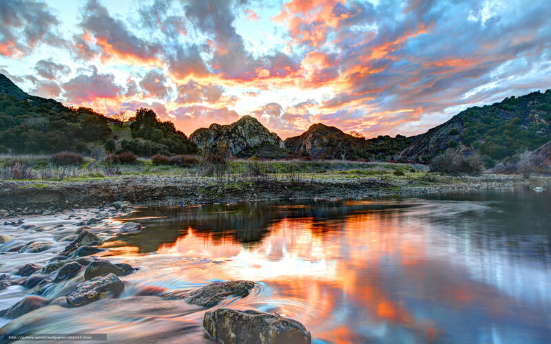 Sunset over river and mountains