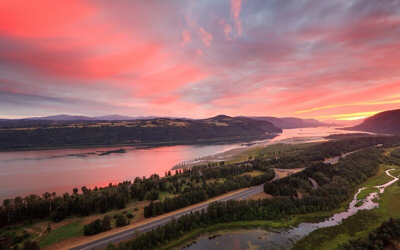 sunset over river and mountains