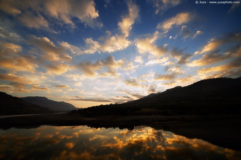 Sunset over river and mountains