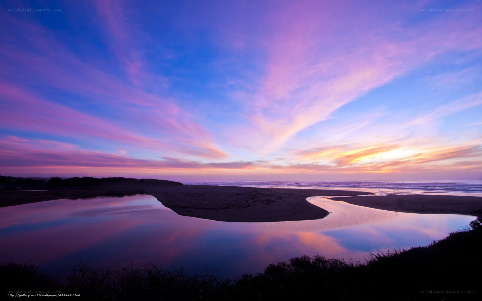 Sunset over river and ocean