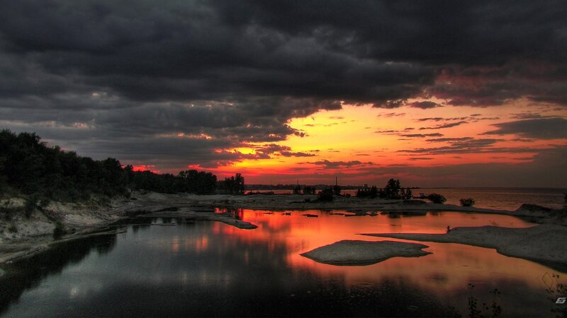 Sunset over River Delta — Orange, Dramatic