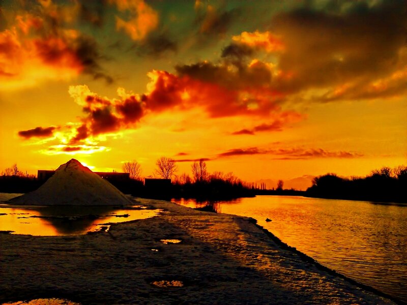 Sunset over River — Orange, Dramatic, Photograph, Clouds, Pile of Salt