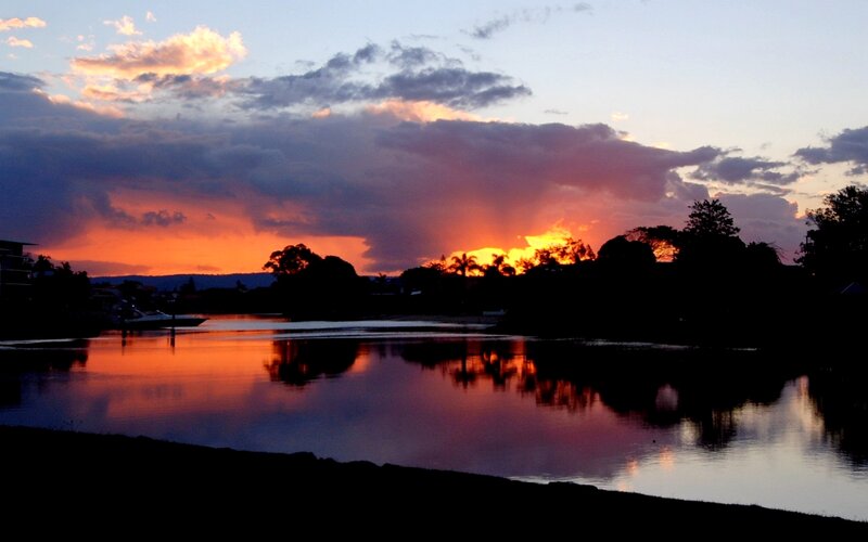 Sunset over River — Orange, Dramatic, Photograph, Clouds, Trees, Boat