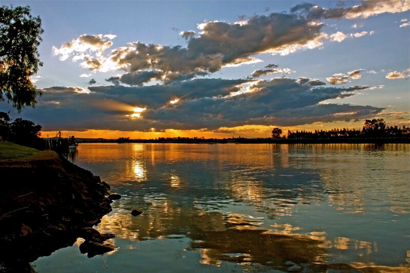 Sunset over River — Orange, Dramatic, Photograph, Clouds, Trees, Dock
