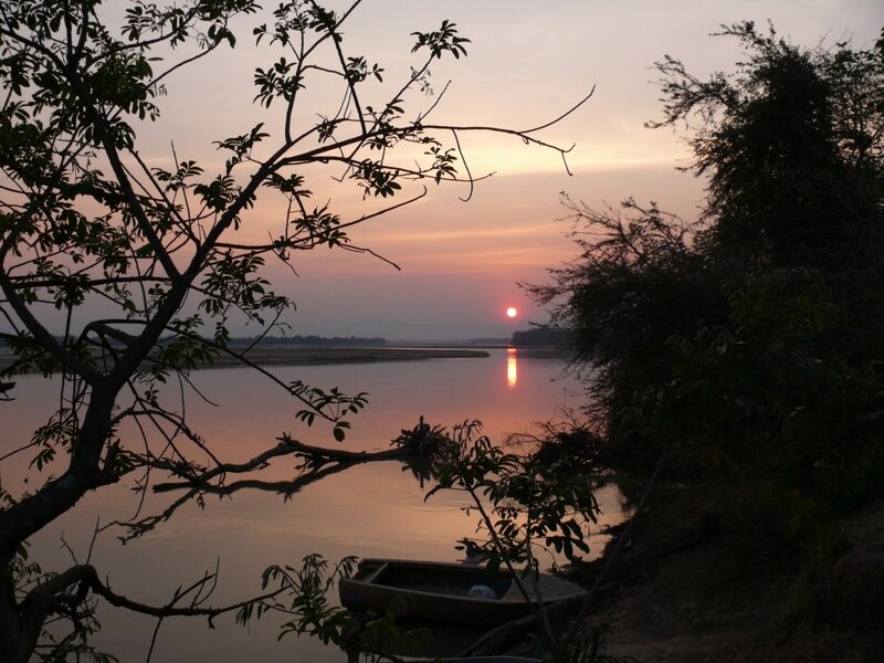 Sunset over River — Orange, Serene, Photograph, Boat, Trees