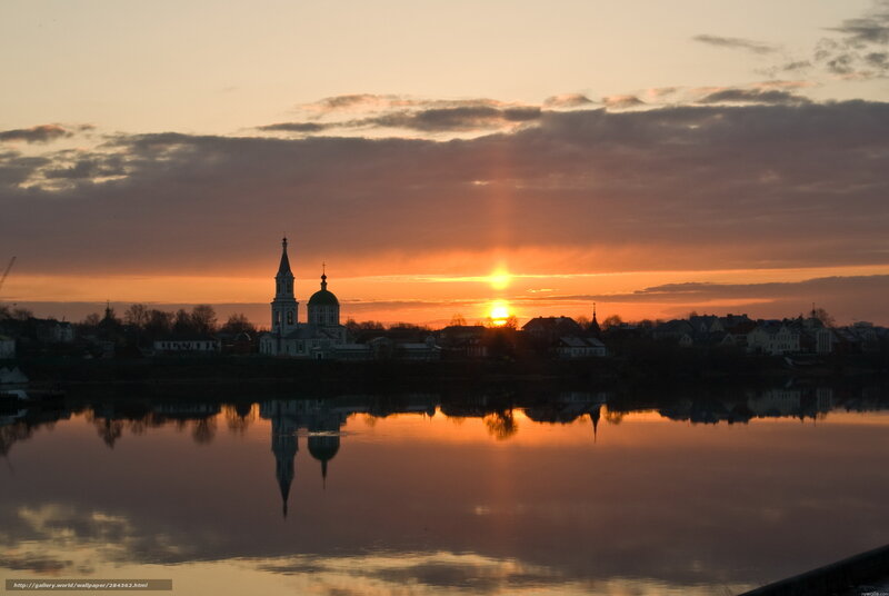 Sunset over river town