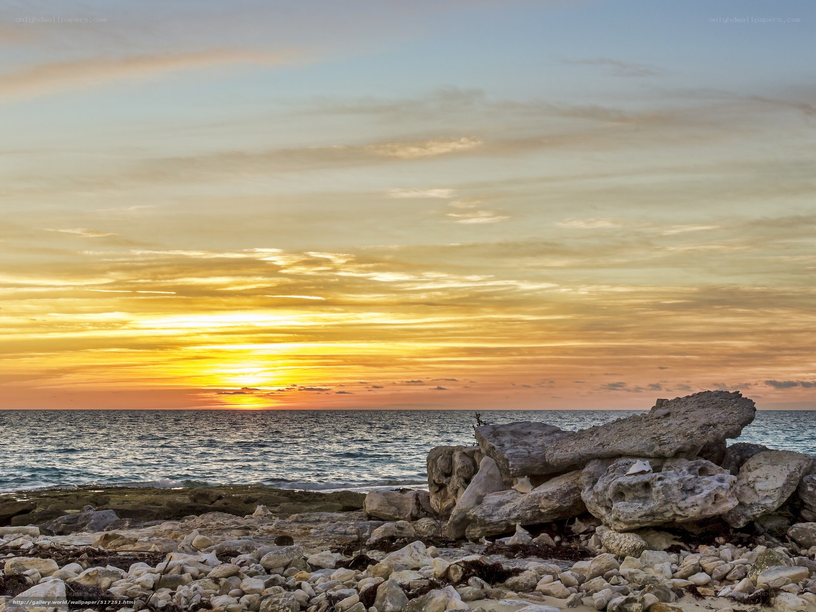 Sunset over rocky beach