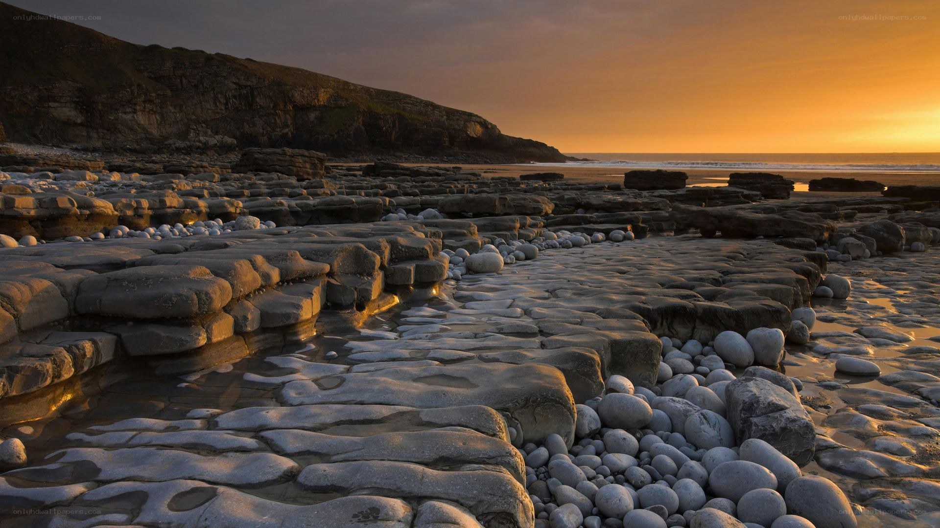 Sunset over rocky beach