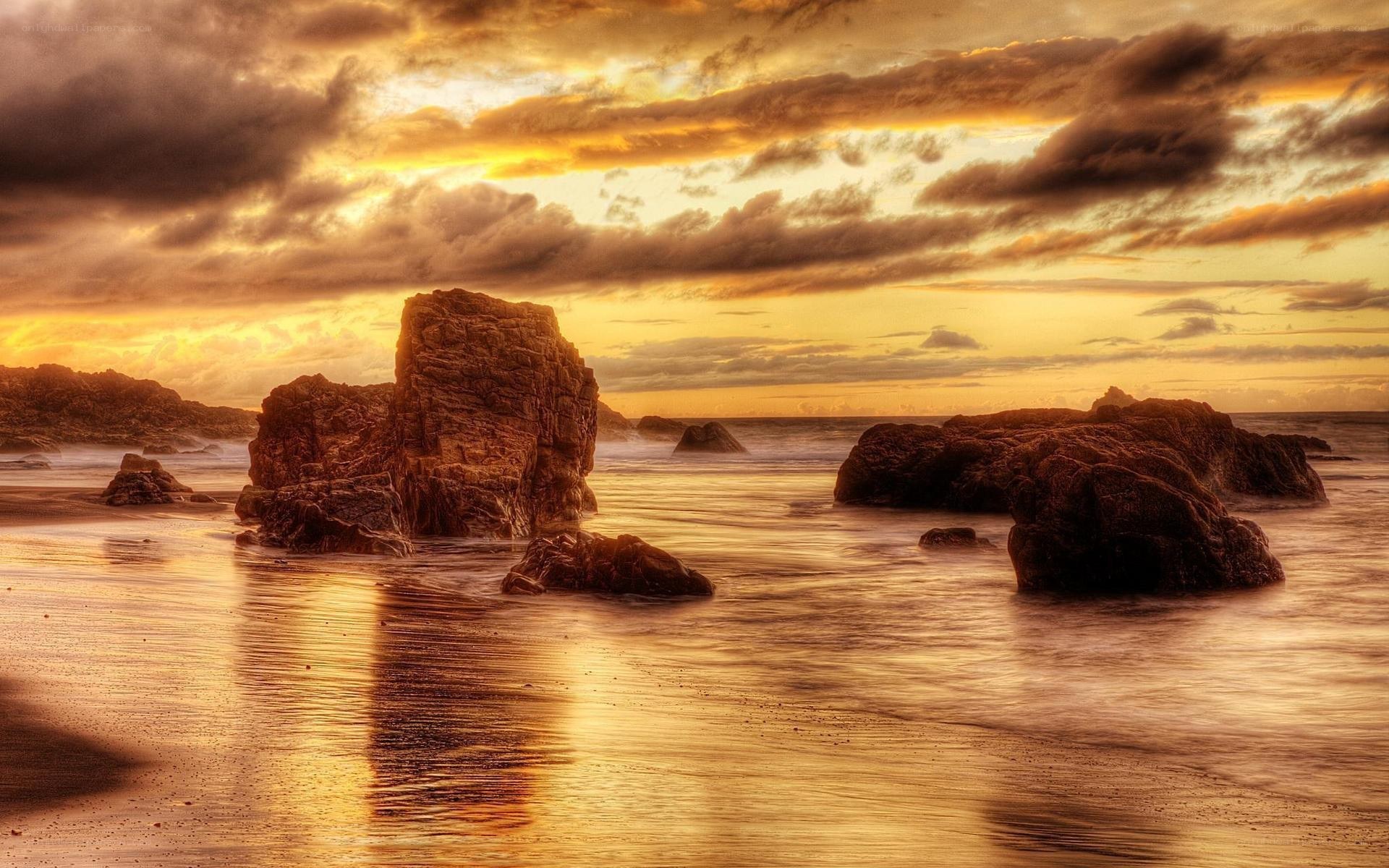 Sunset over rocky beach