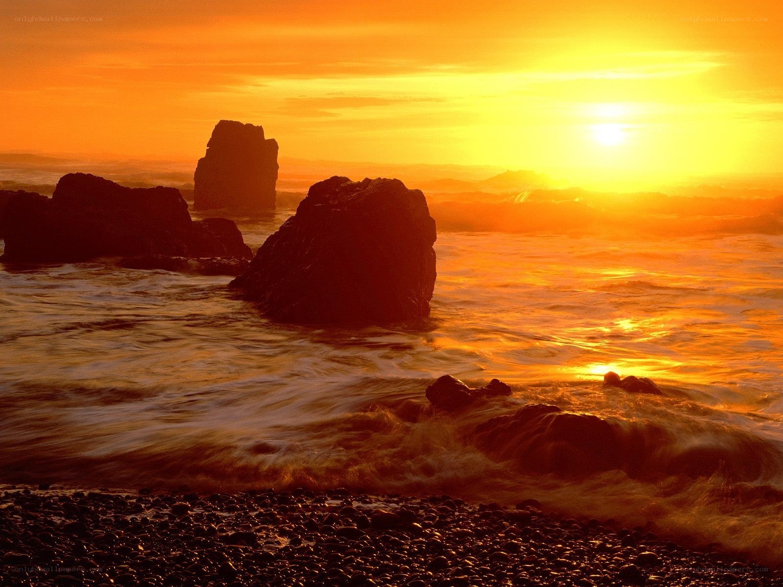 Sunset over rocky beach