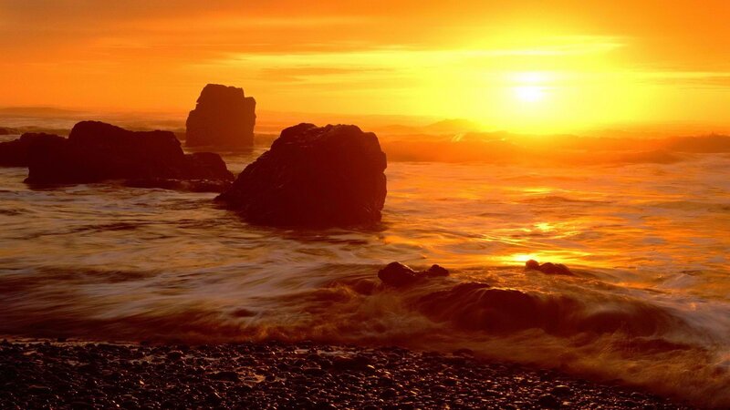 Sunset over rocky beach