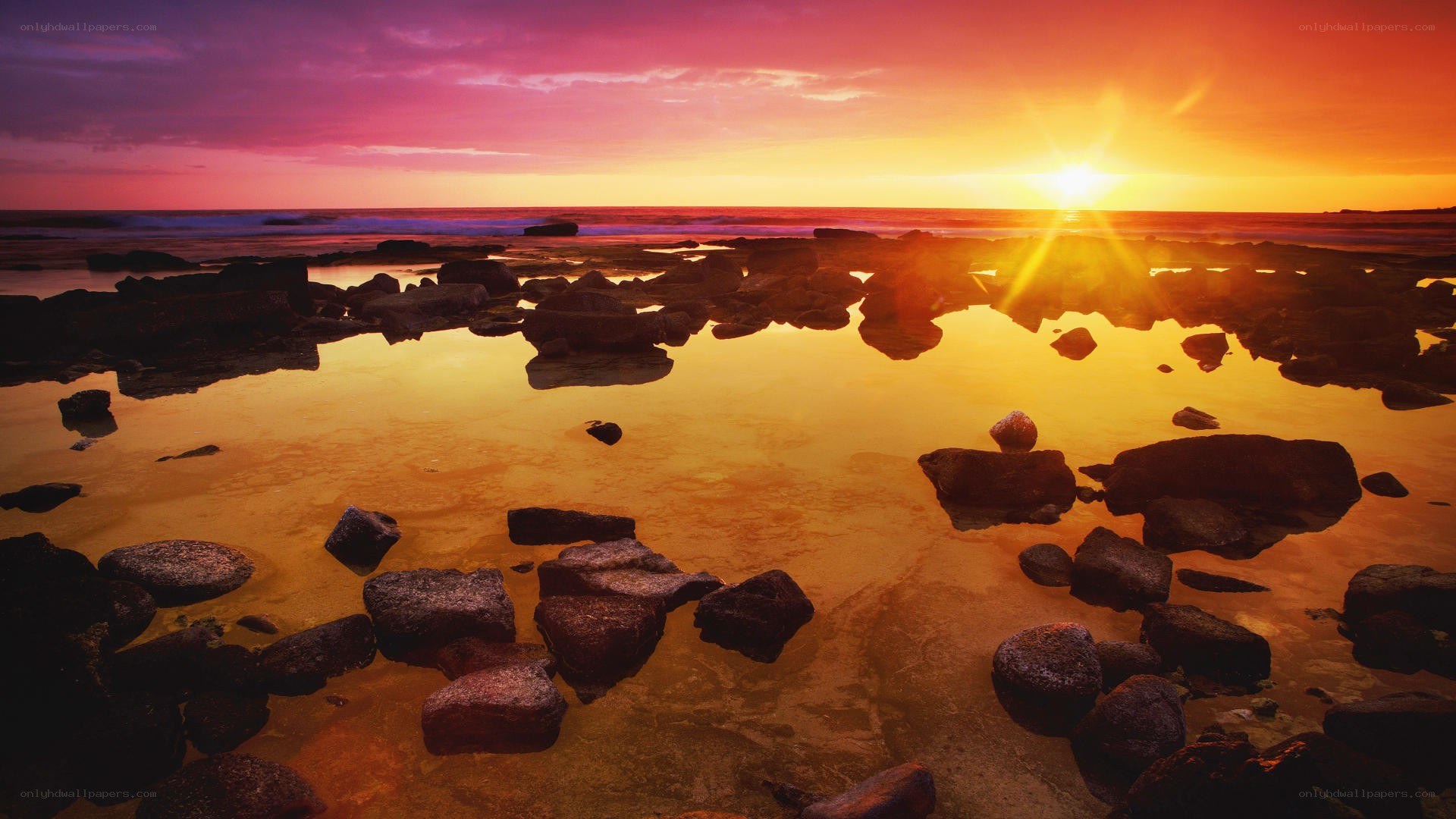Sunset over rocky beach