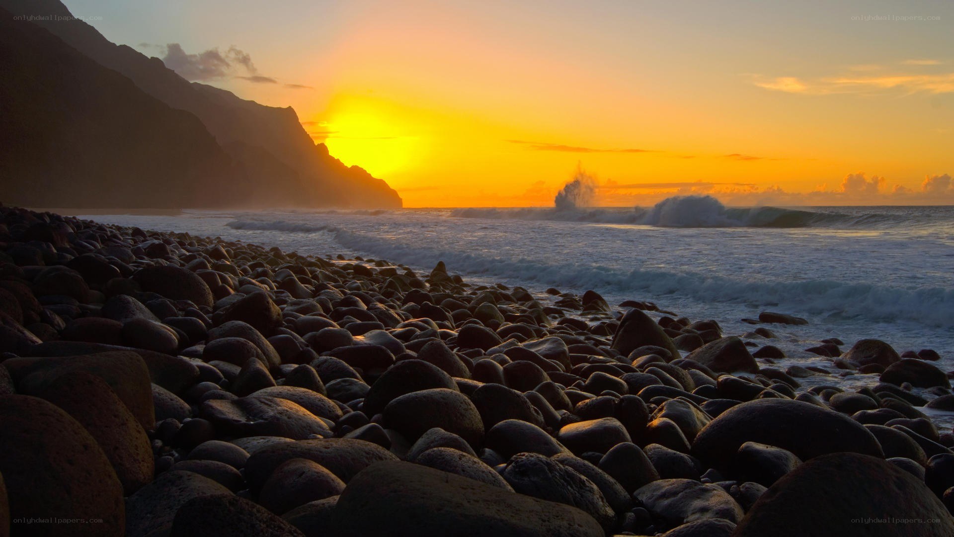 Sunset over rocky beach