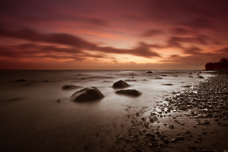 Sunset over rocky beach