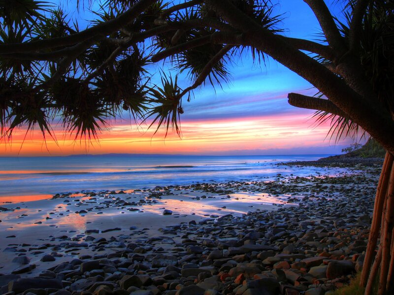 Sunset over rocky beach