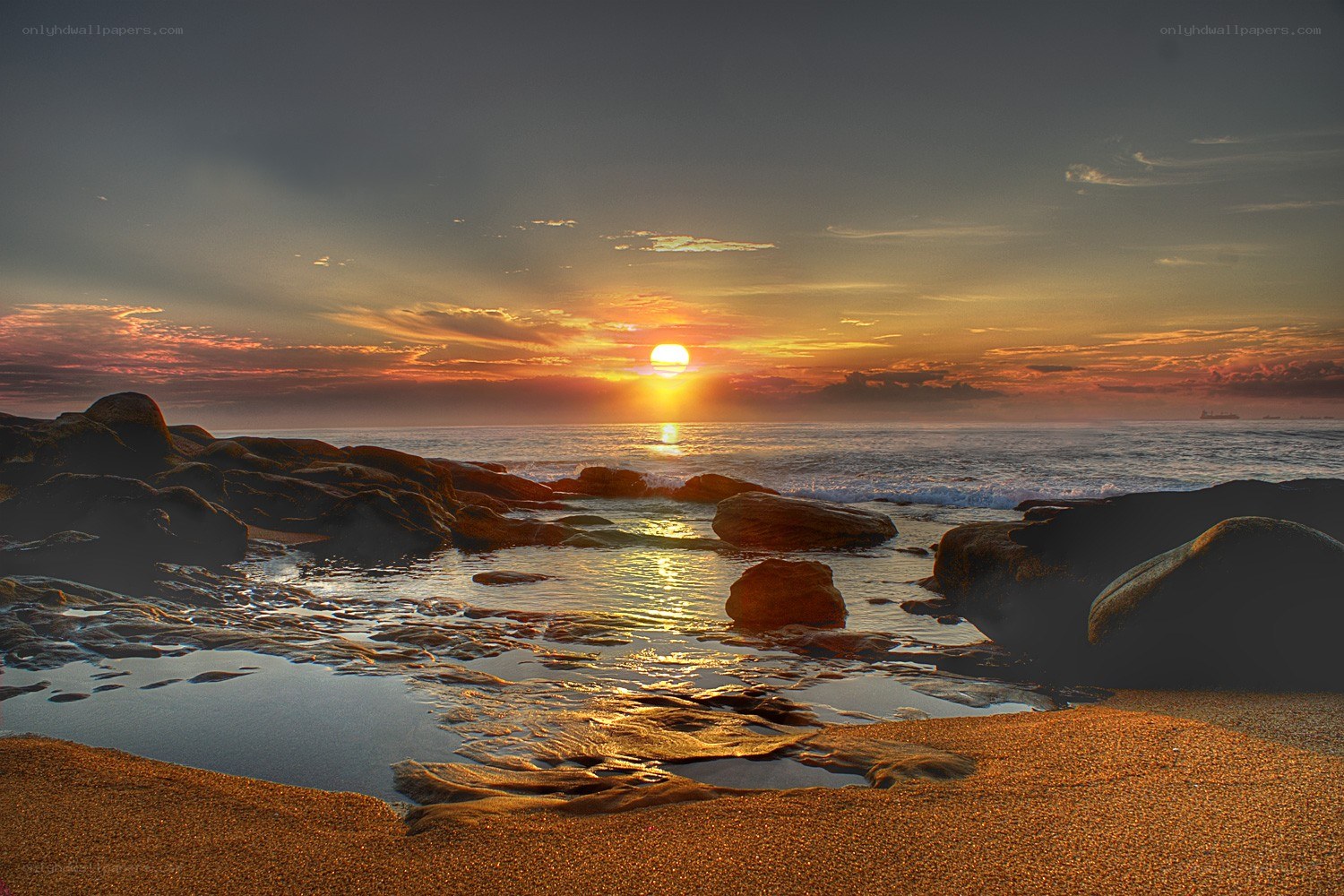 Sunset over rocky beach