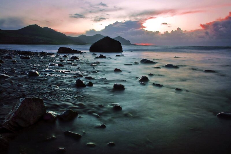Sunset over rocky beach