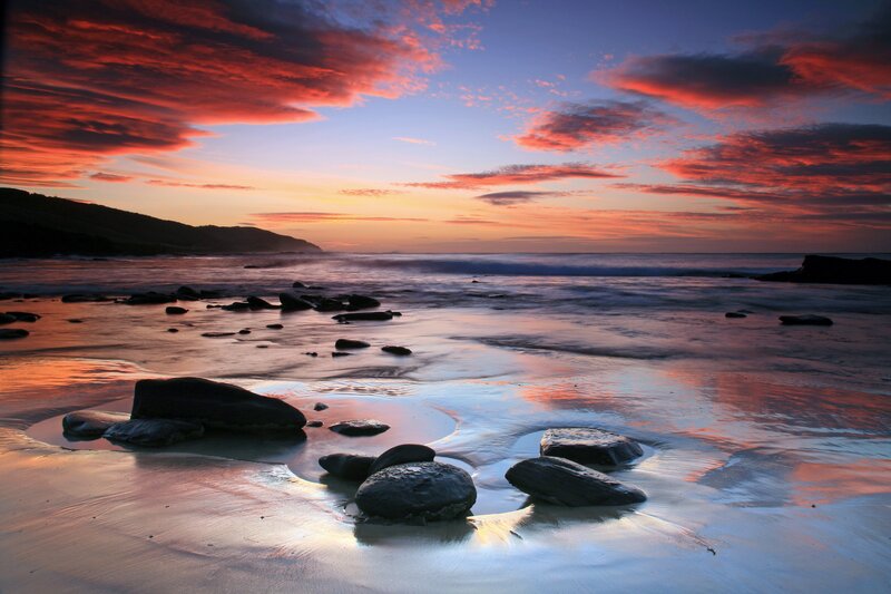 Sunset over rocky beach
