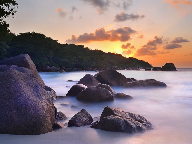 Sunset over rocky beach