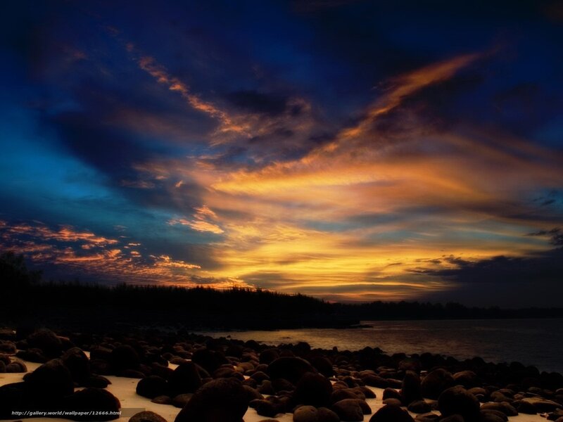 Sunset over rocky beach