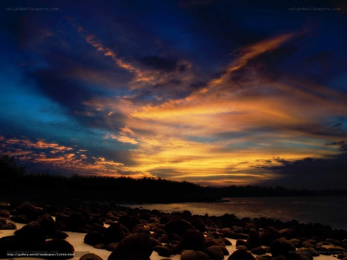 Sunset over rocky beach