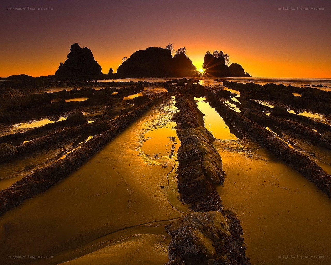 Sunset over rocky beach