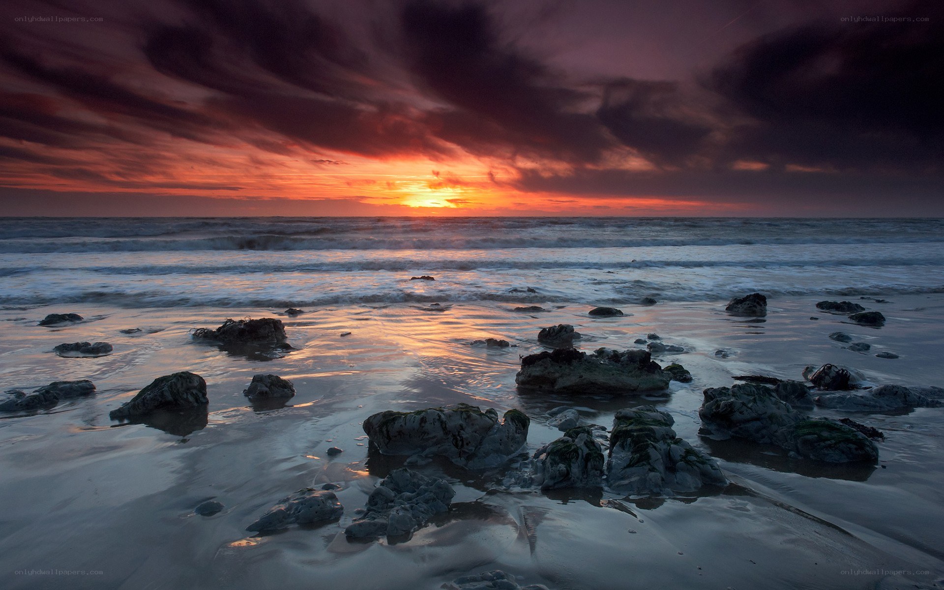 Sunset over rocky beach