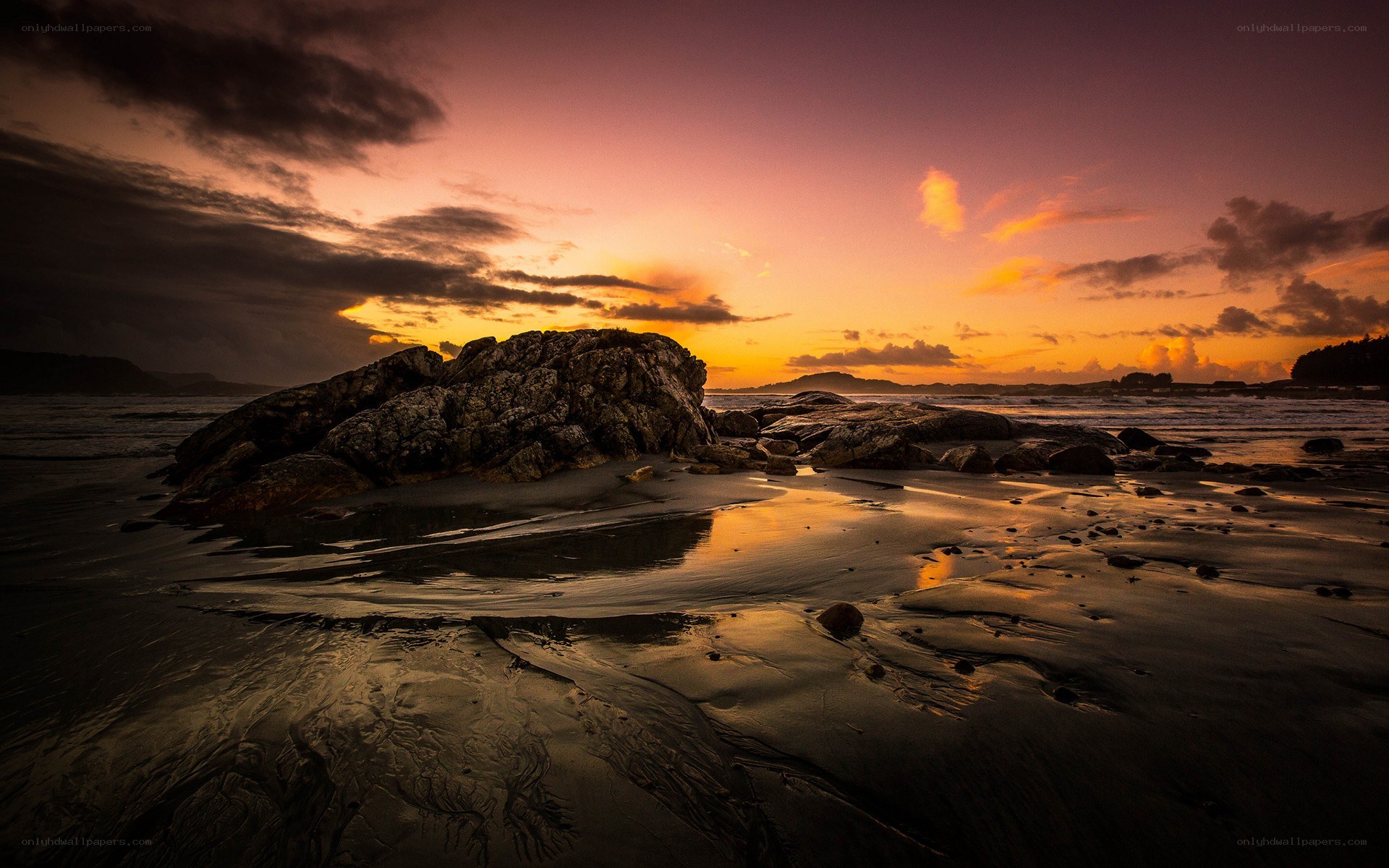 Sunset over rocky beach