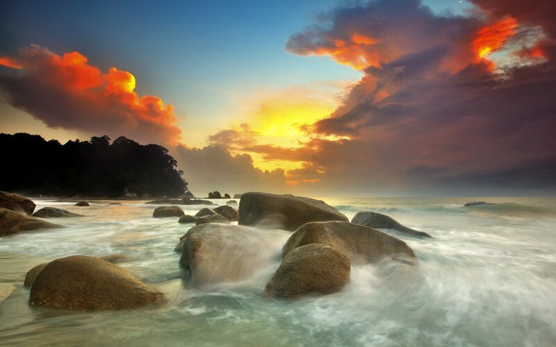 Sunset over rocky beach