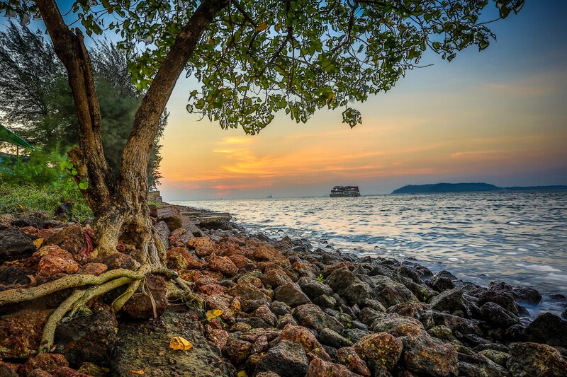 Sunset over rocky beach