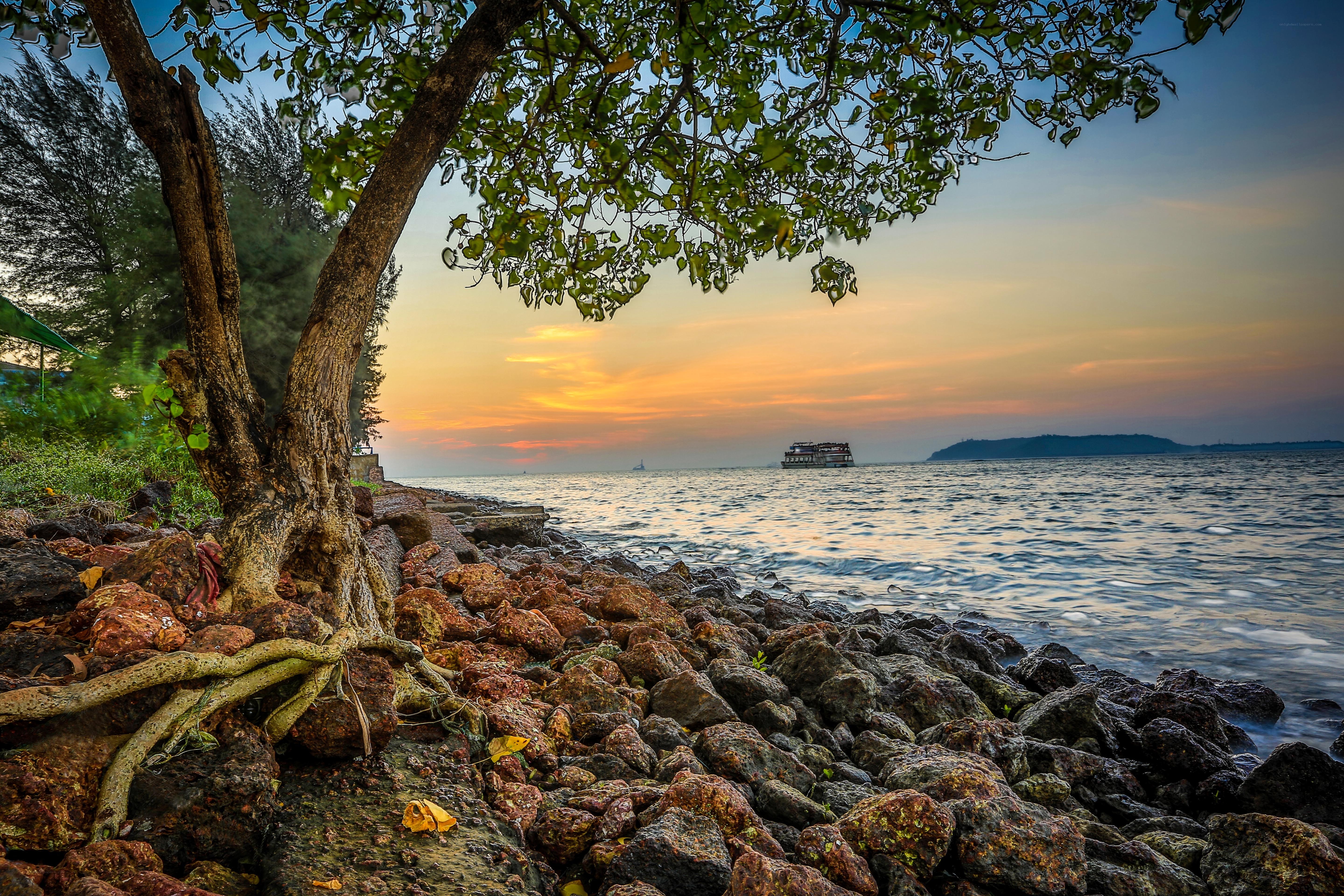 Sunset over rocky beach