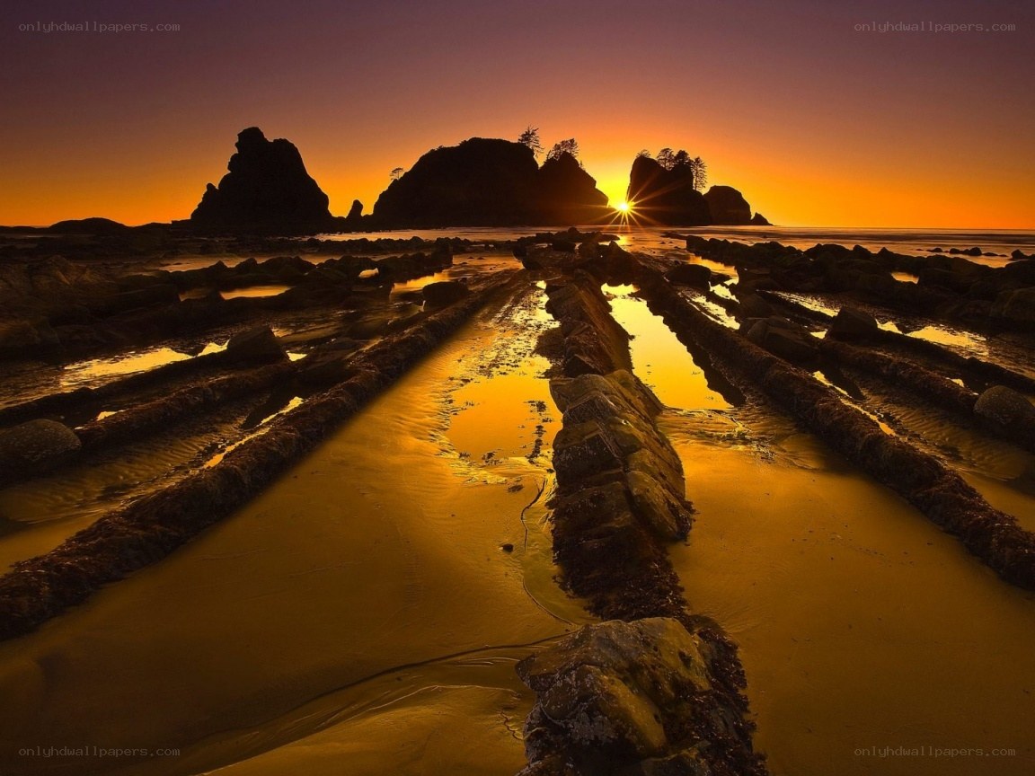 Sunset over rocky beach