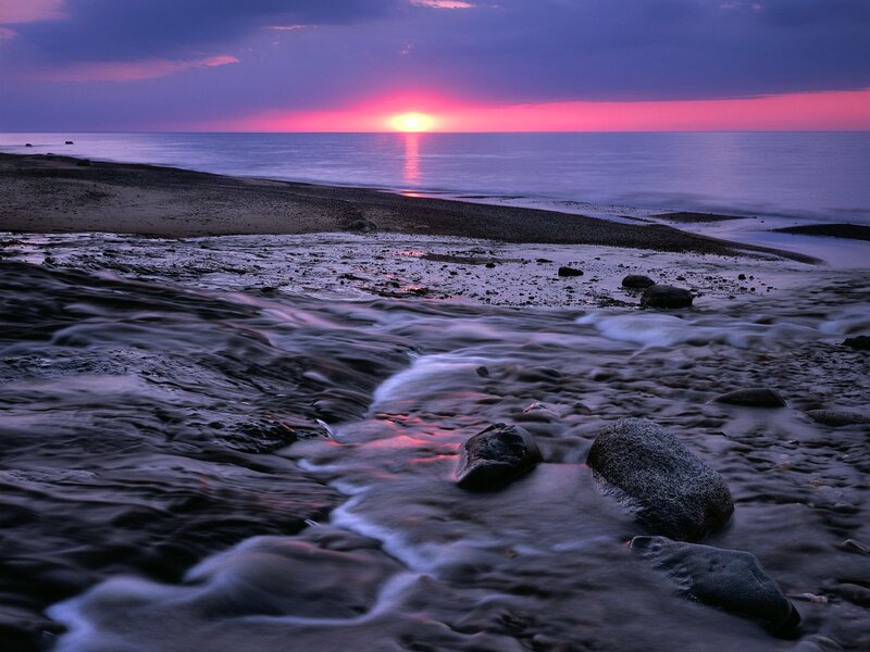 Sunset over rocky beach