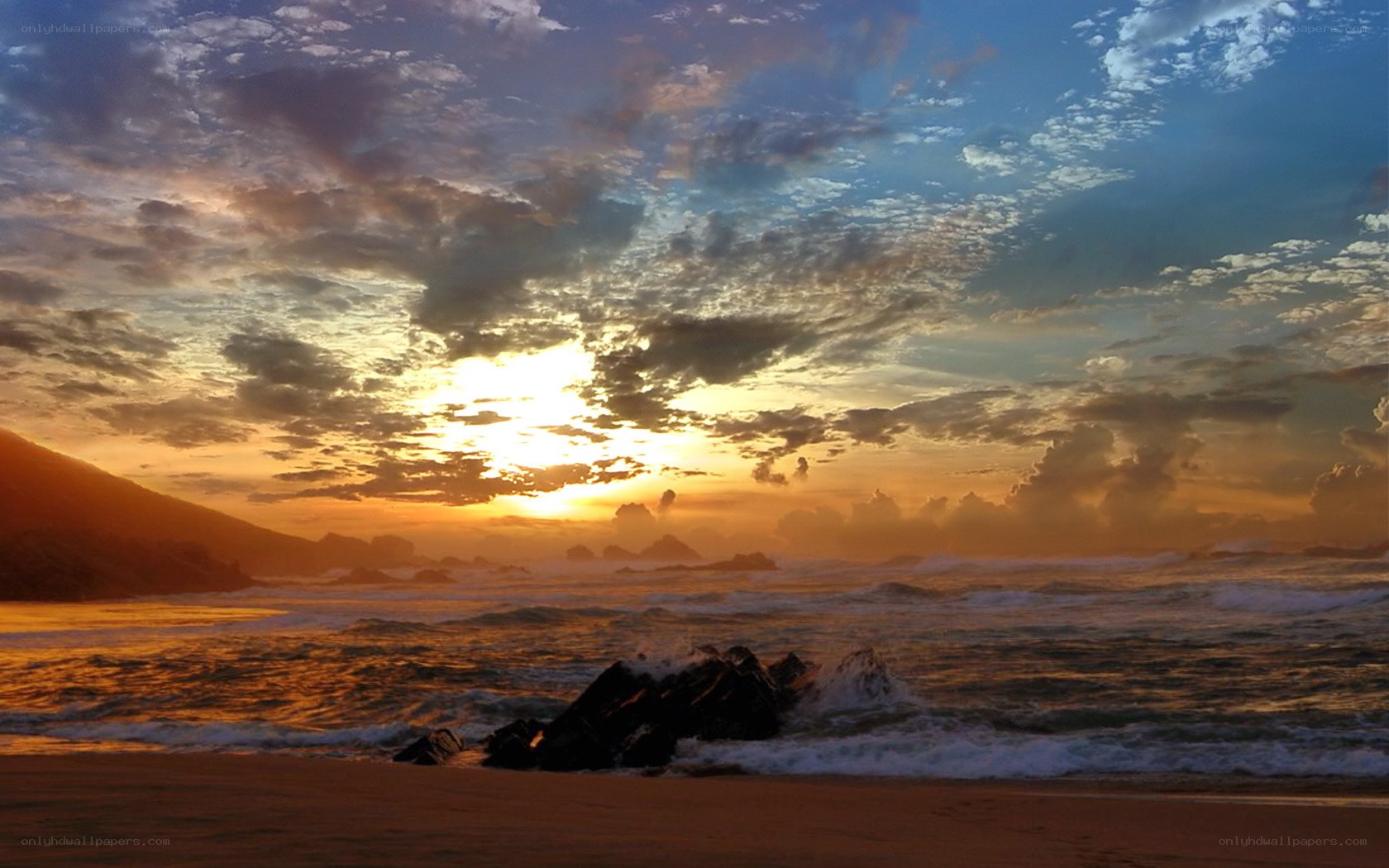 Sunset over rocky beach