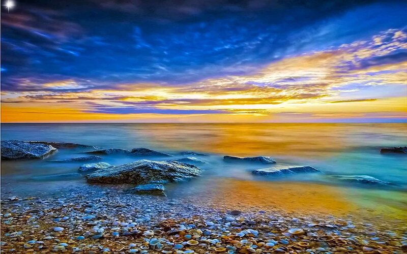 Sunset over rocky beach