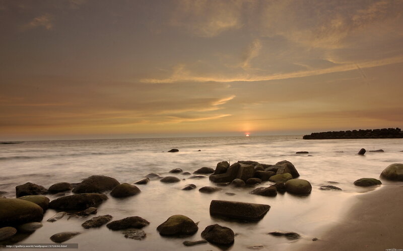 Sunset over rocky beach