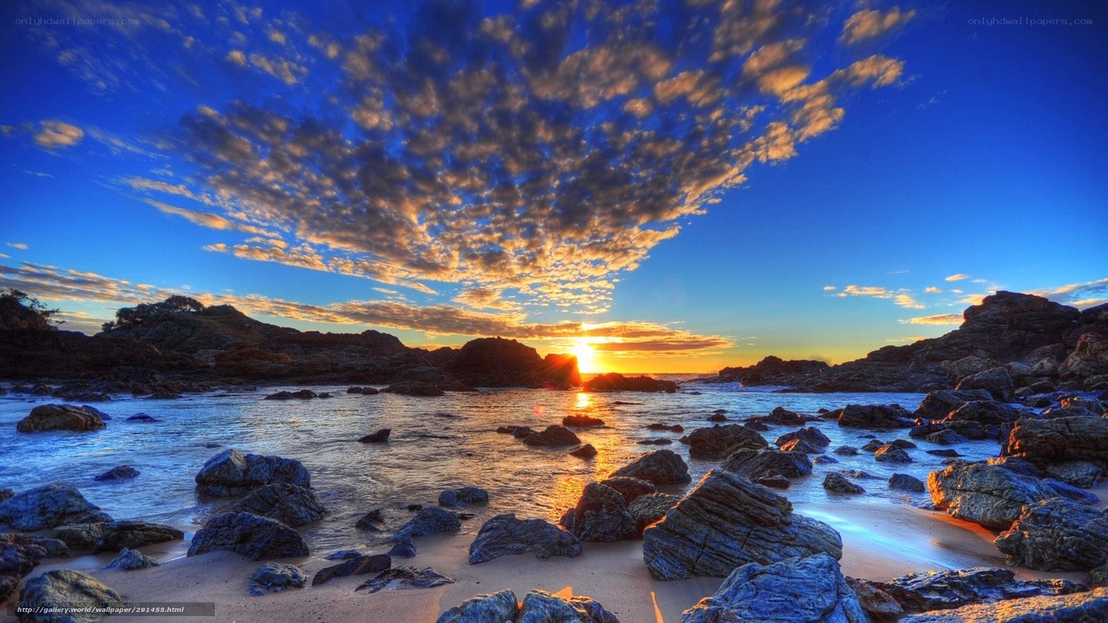 Sunset over rocky beach