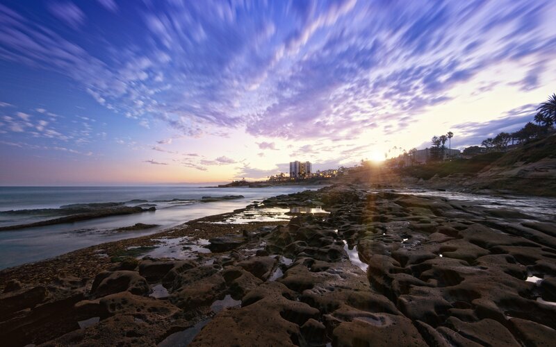 Sunset over rocky beach